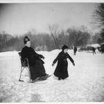 February 13, 1888. Mother of photographer Wallace G. Levison sitting in a special ice-skating chair as a young boy skates near her on the Prospect Park Skating Lake.